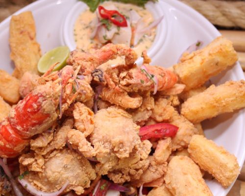 Scrumptious mixed seafood platter served with crispy yuca fries in Arequipa, Perú.